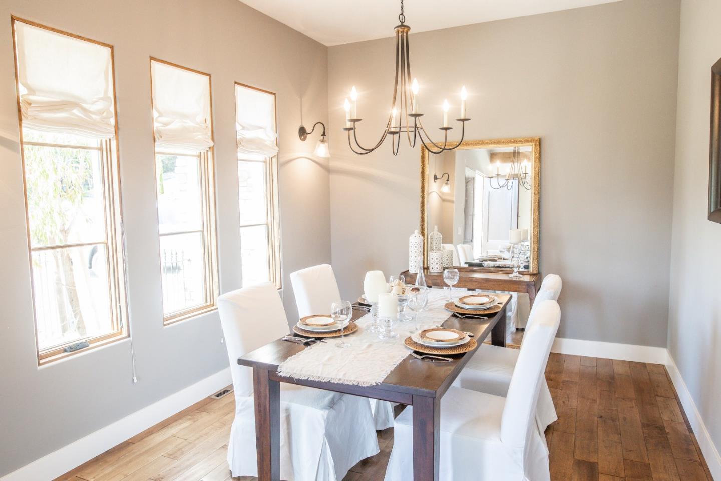 3430 Merrill Road Aptos, CA 95003 - Photo 23 of 49 a view of a dining room with furniture a chandelier and wooden floor