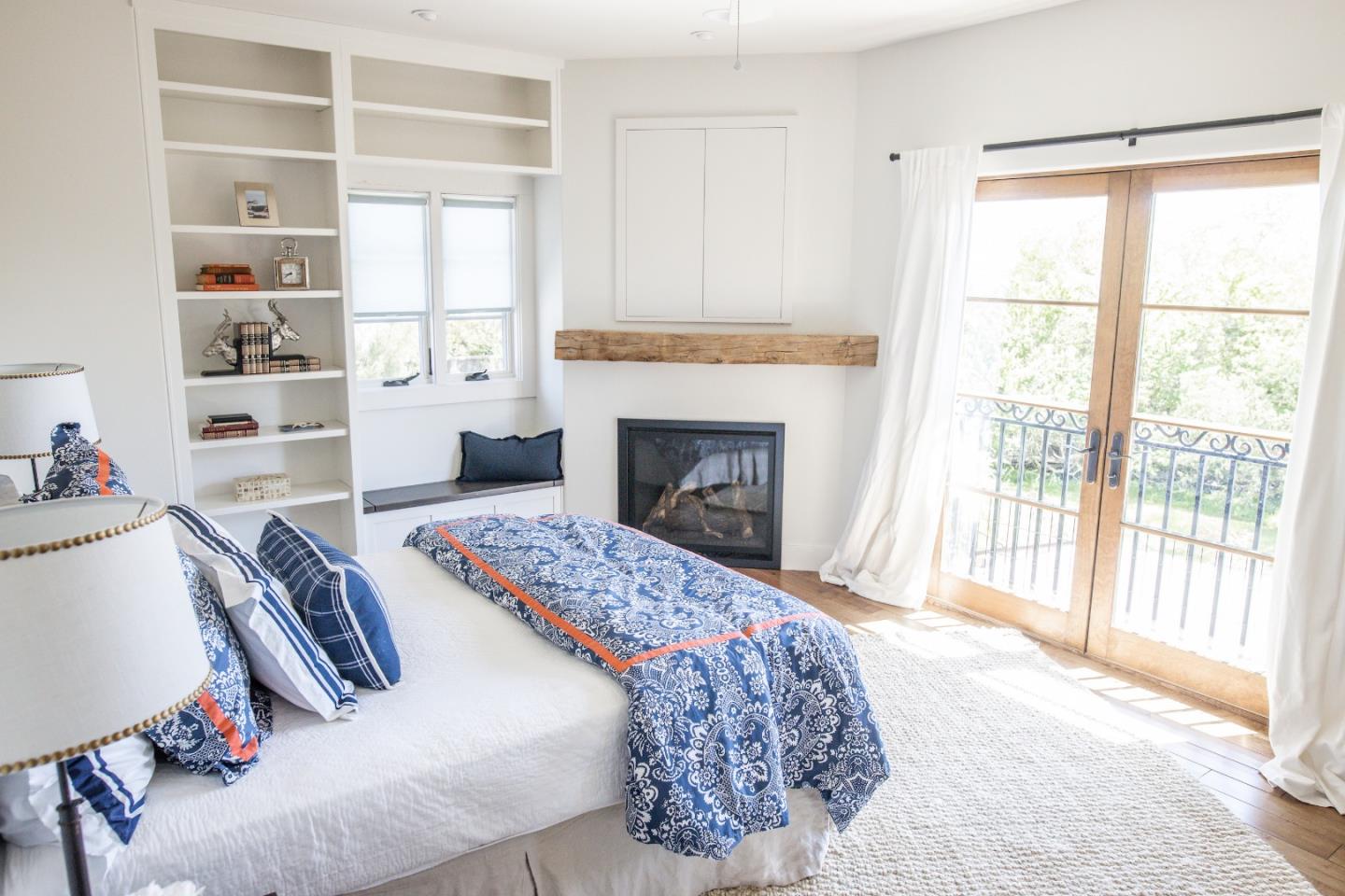 3430 Merrill Road Aptos, CA 95003 - Photo 30 of 49 a bedroom with a bed and a fireplace