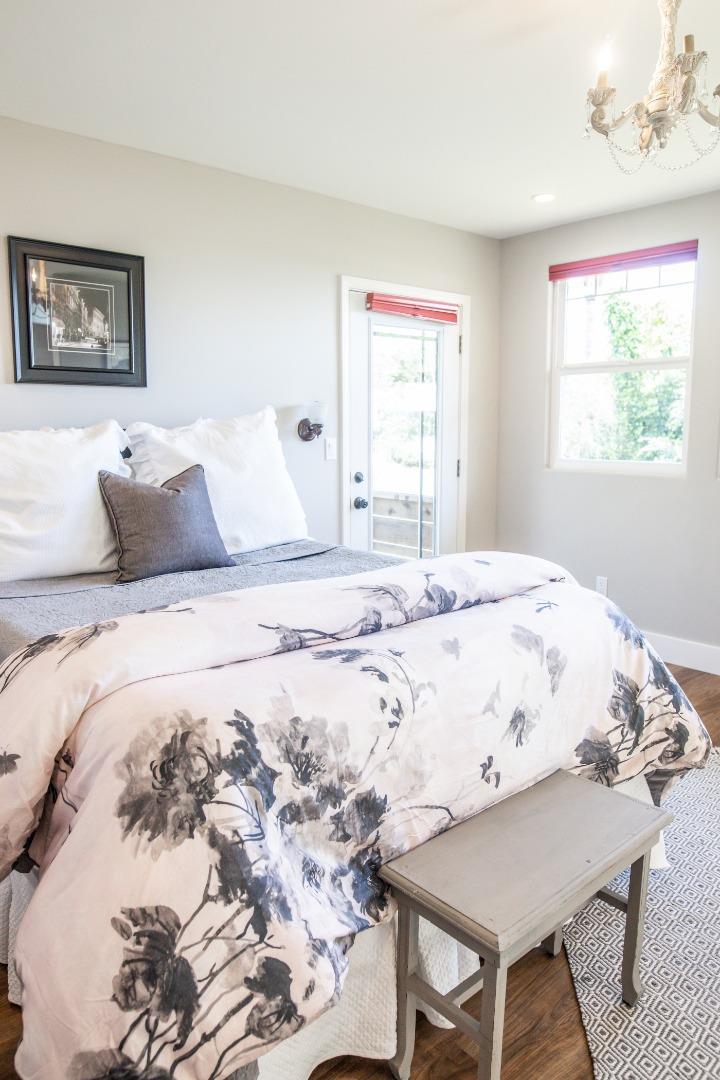 3430 Merrill Road Aptos, CA 95003 - Photo 39 of 49 a large bed sitting in a bedroom next to a window