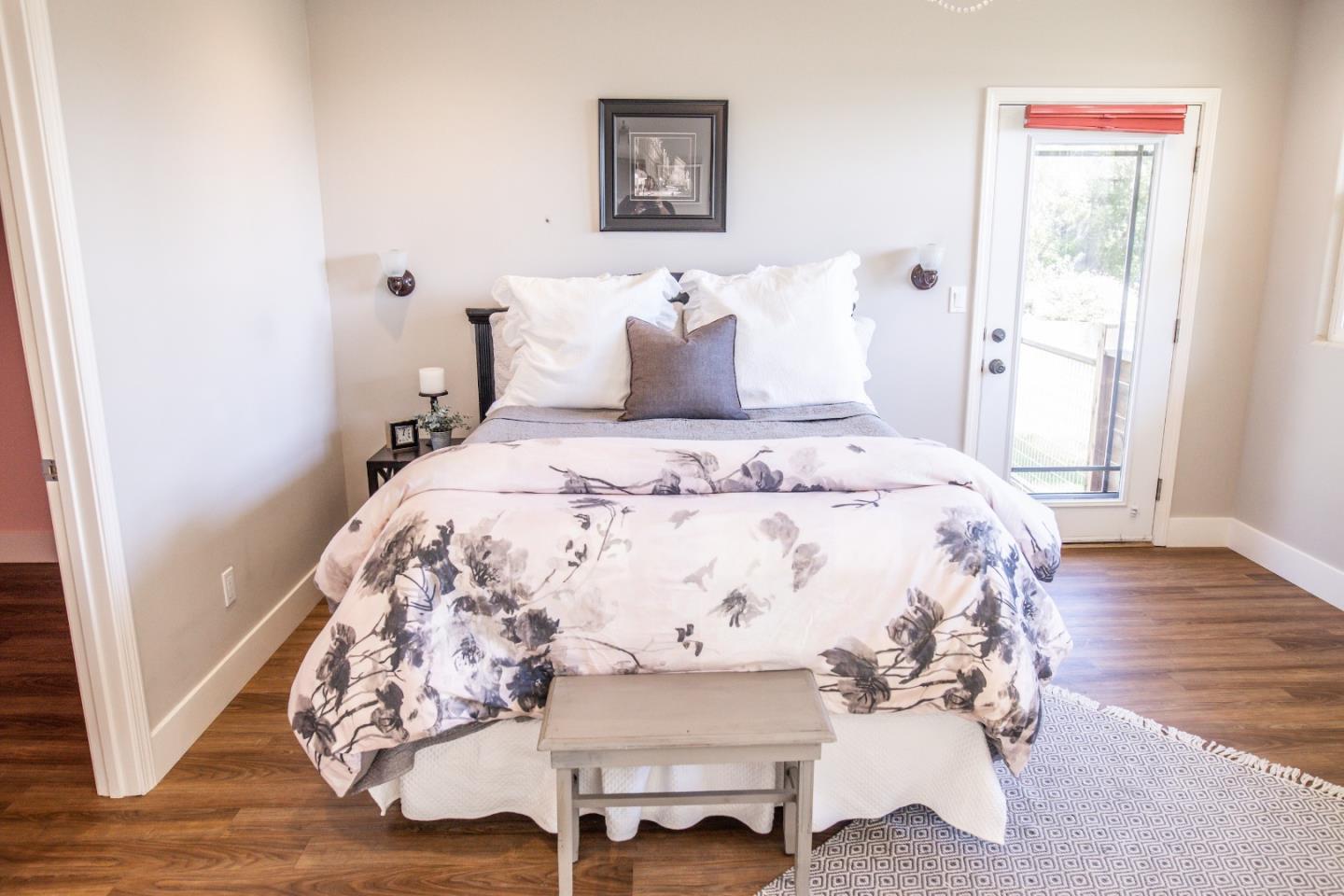 3430 Merrill Road Aptos, CA 95003 - Photo 41 of 49 a bedroom with a bed and wooden floor