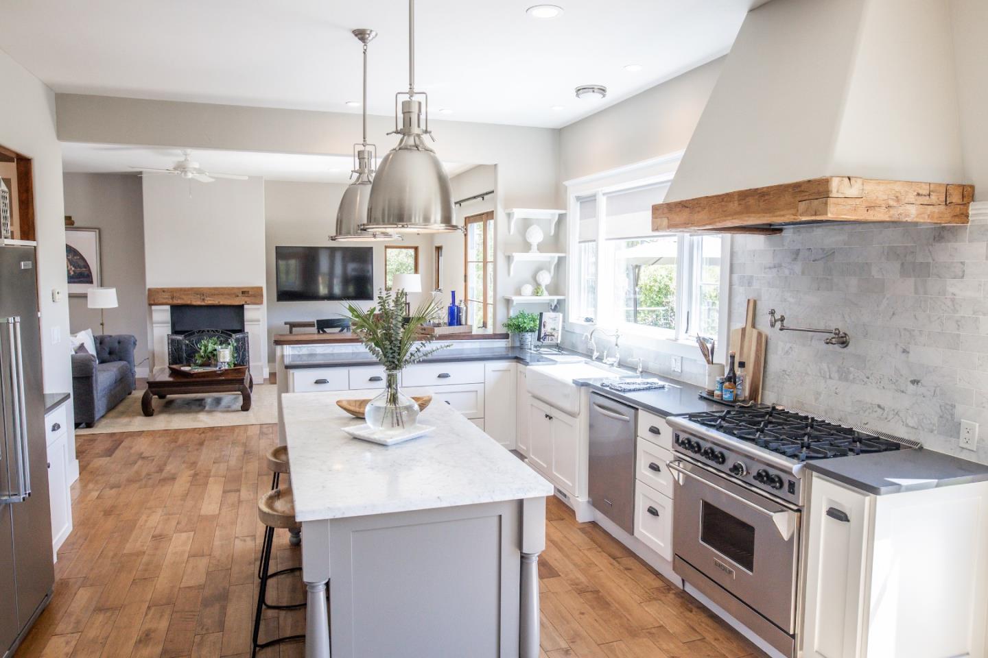 3430 Merrill Road Aptos, CA 95003 - Photo 10 of 49 a kitchen with stainless steel appliances kitchen island a sink stove and cabinets