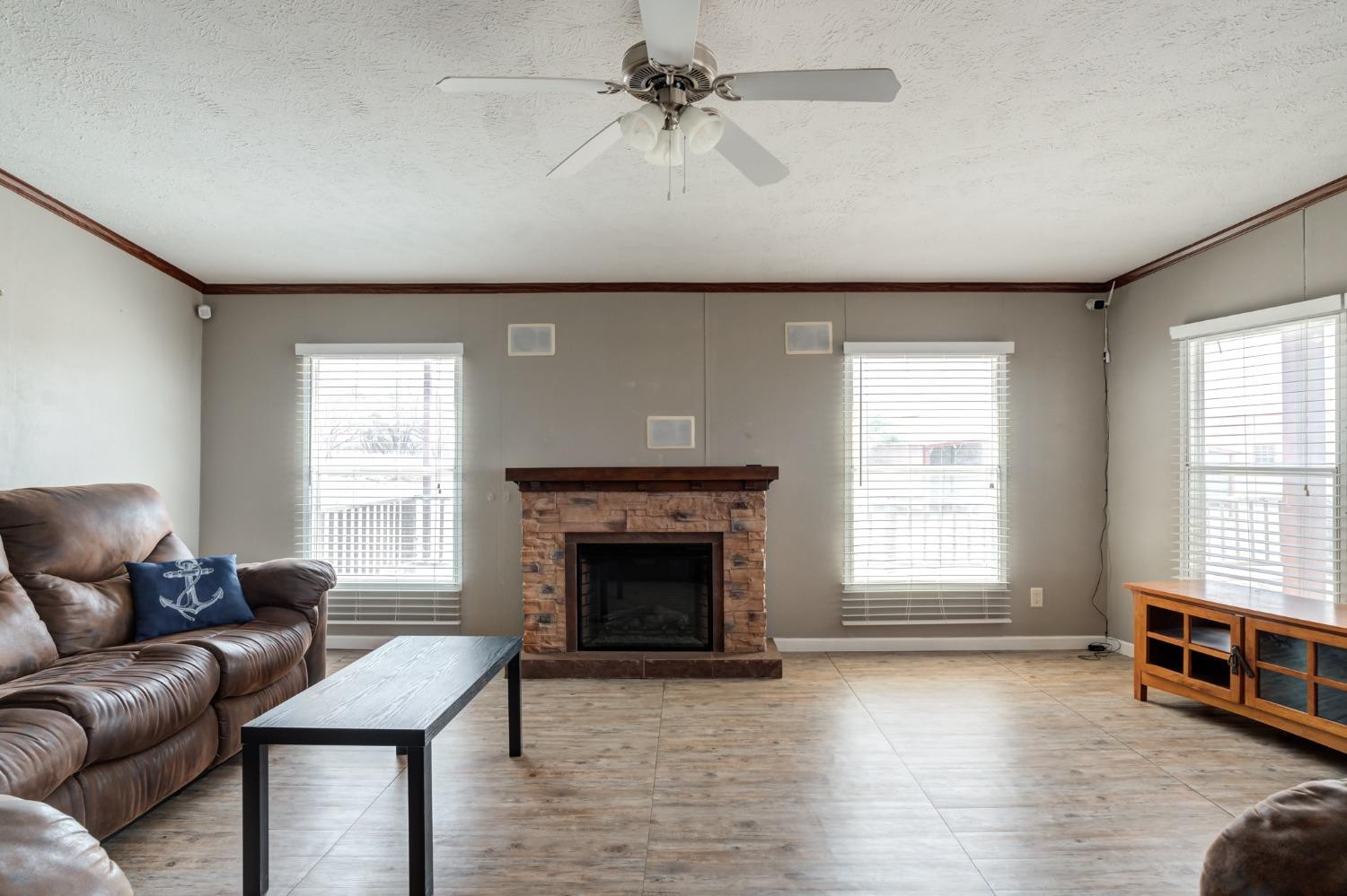 2446 Turkey Ridge Justiceburg, TX 79330 - Photo 13 of 50 a living room with furniture and a fireplace