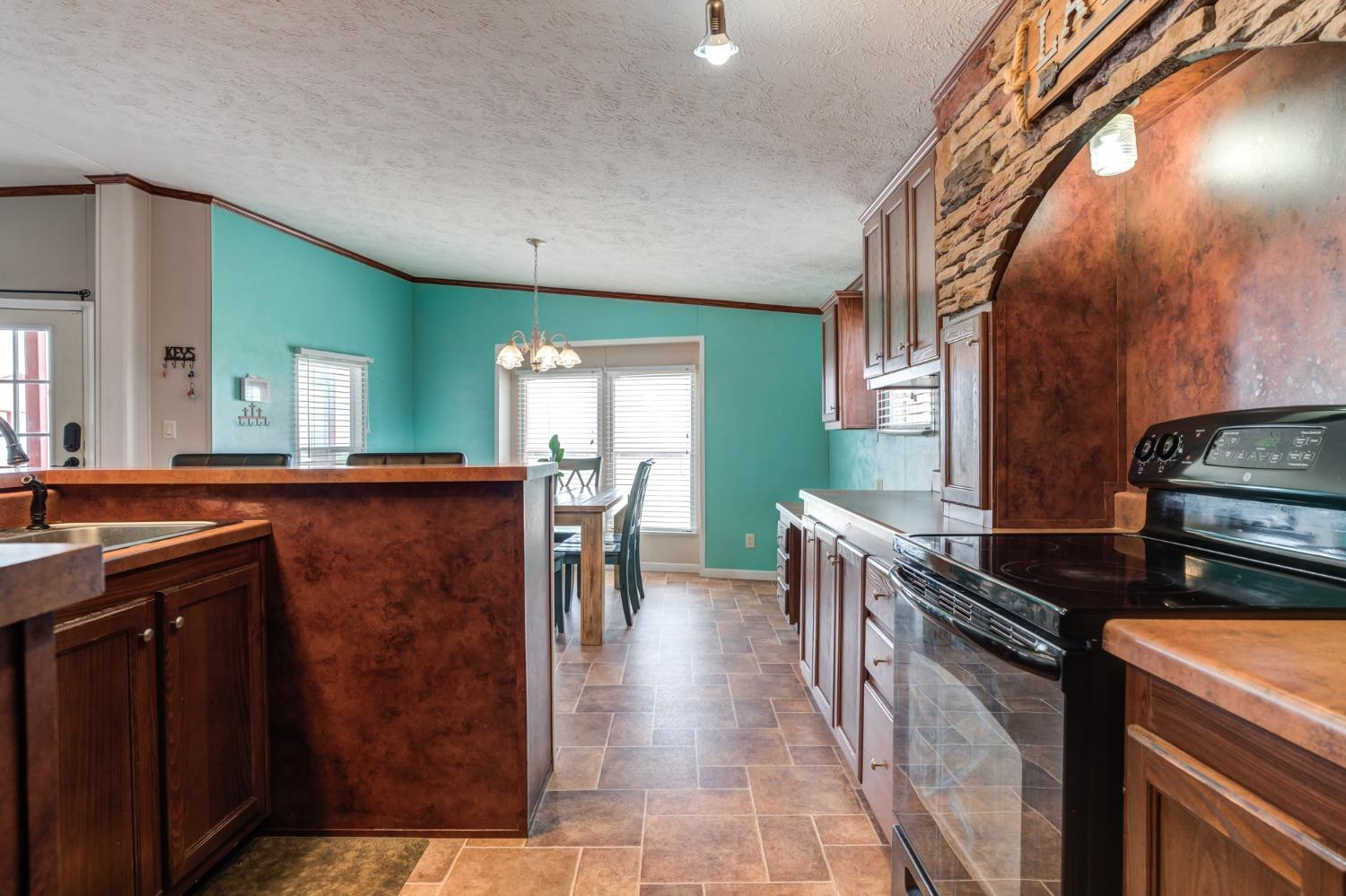 2446 Turkey Ridge Justiceburg, TX 79330 - Photo 22 of 50 a kitchen with table and chairs