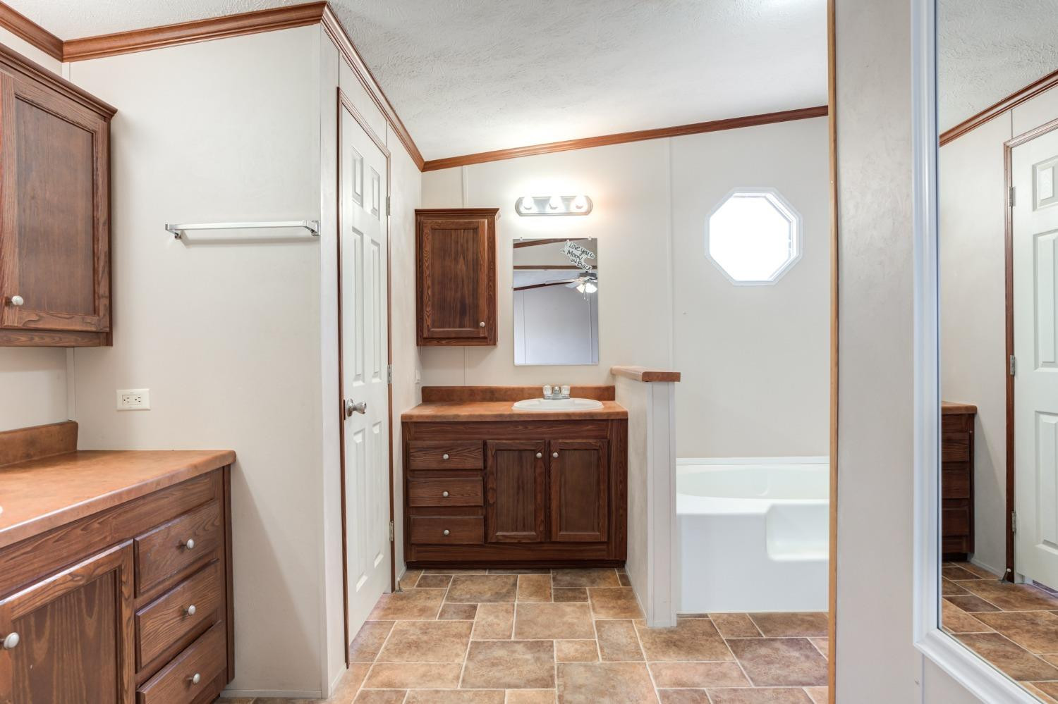 2446 Turkey Ridge Justiceburg, TX 79330 - Photo 29 of 50 a bathroom with a sink and a mirror