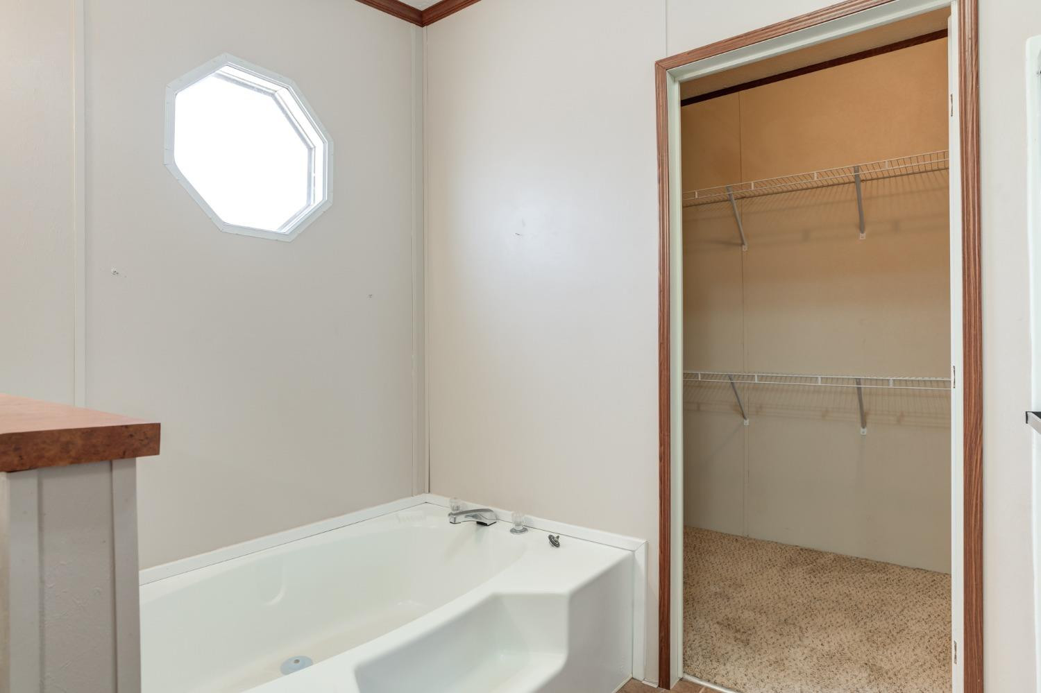 2446 Turkey Ridge Justiceburg, TX 79330 - Photo 31 of 50 a bathroom with a bathtub and a sink