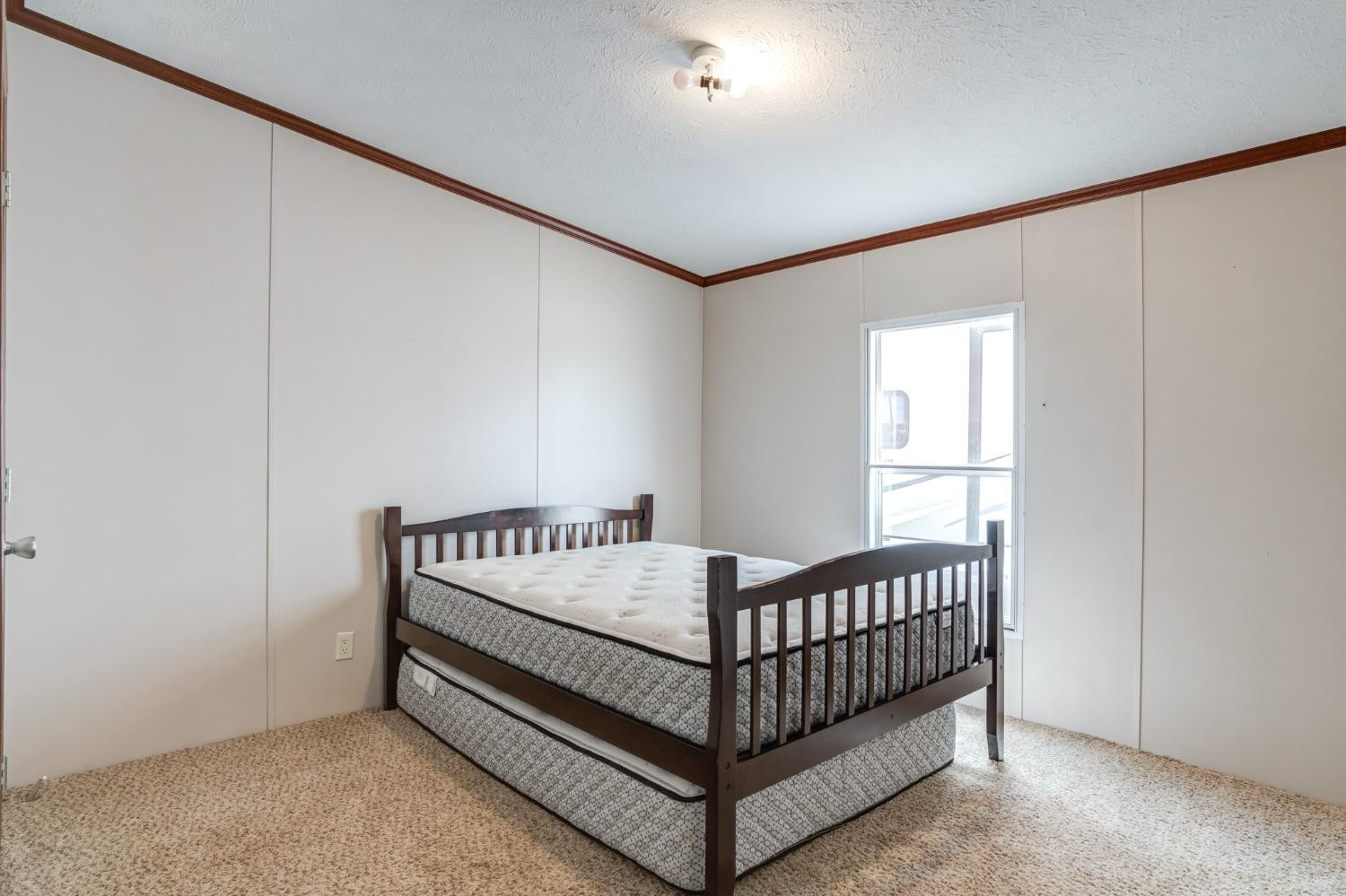 2446 Turkey Ridge Justiceburg, TX 79330 - Photo 35 of 50 a bed sitting in a bedroom next to a window