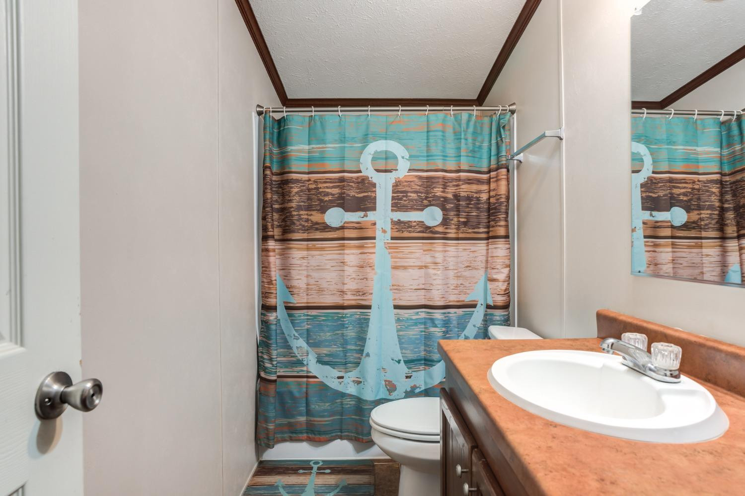 2446 Turkey Ridge Justiceburg, TX 79330 - Photo 38 of 50 a bathroom with a sink toilet and shower