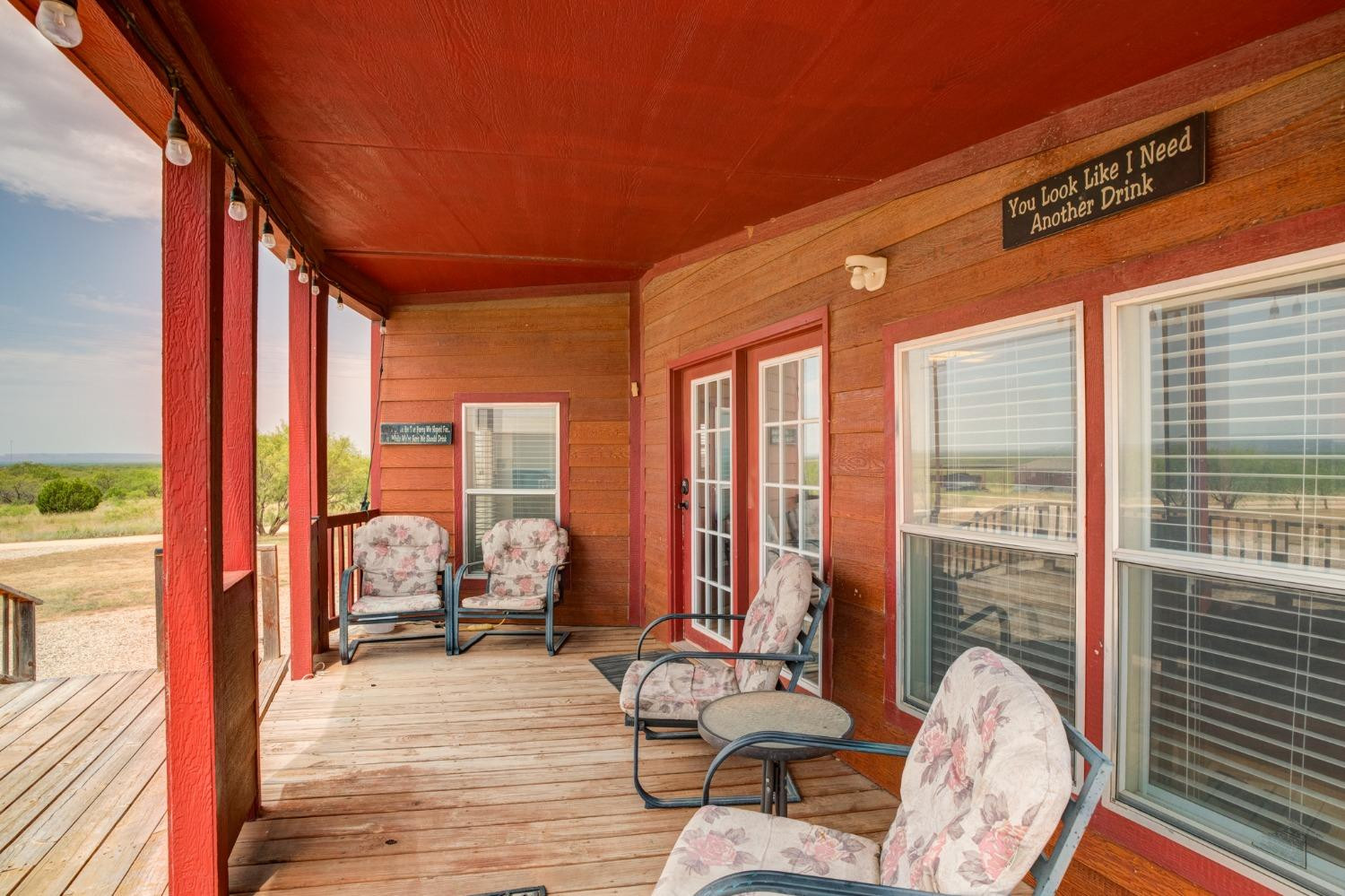 2446 Turkey Ridge Justiceburg, TX 79330 - Photo 5 of 50 a view of living room with furniture and floor to ceiling windows