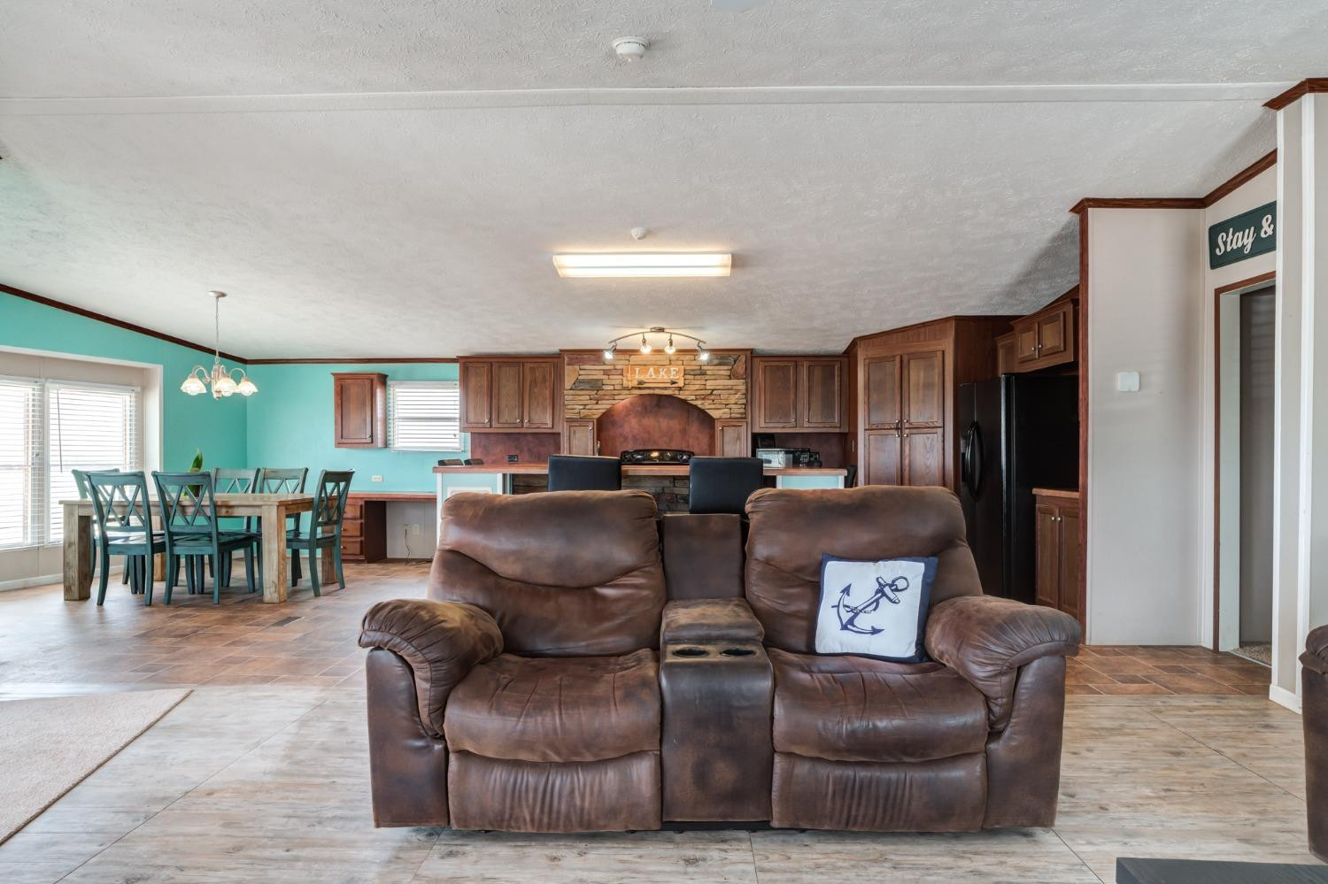 2446 Turkey Ridge Justiceburg, TX 79330 - Photo 10 of 50 a living room with furniture and a chandelier