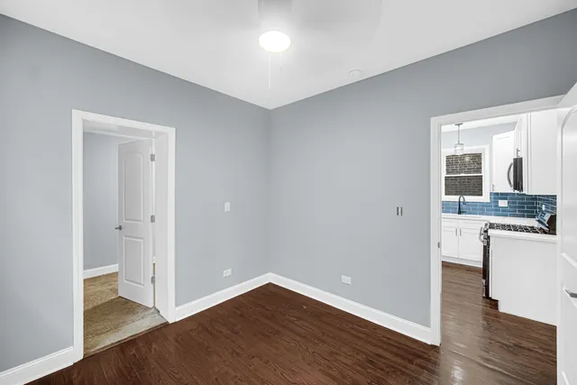 a view of a kitchen cabinets and wooden floor