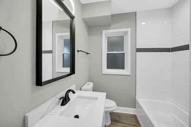 a bathroom with a sink and a bathtub