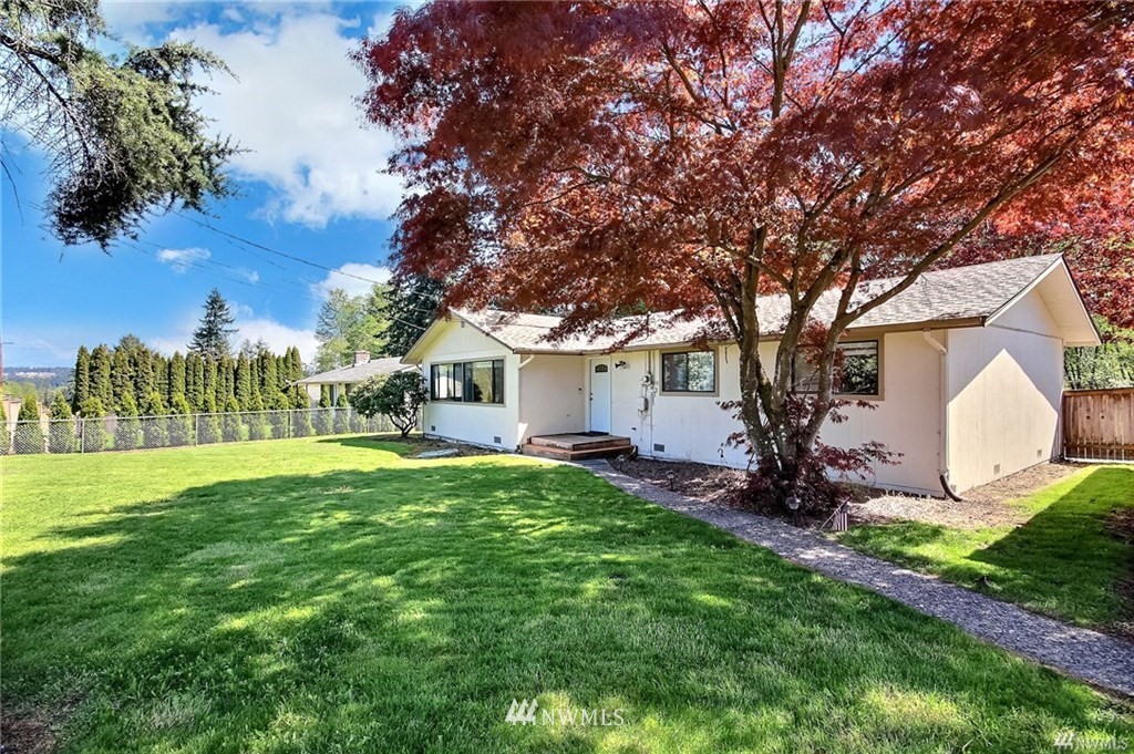 508 228th Street Southeast Bothell, WA 98021 - Photo 2 of 22 a front view of a house with garden