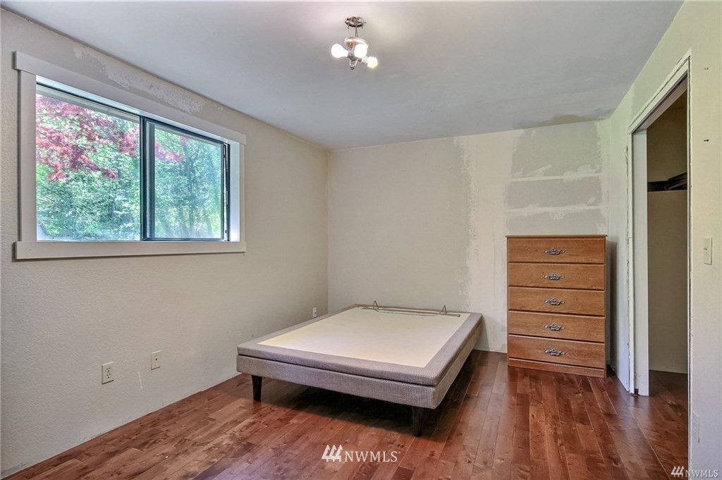 508 228th Street Southeast Bothell, WA 98021 - Photo 12 of 22 a bedroom with a bed and a window