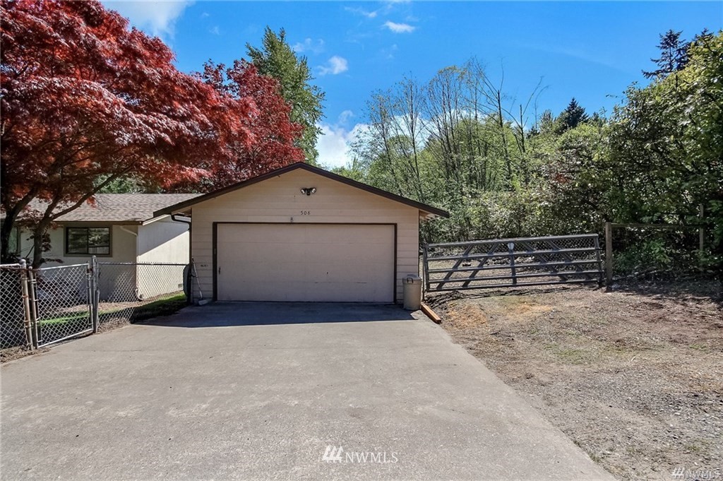 508 228th Street Southeast Bothell, WA 98021 - Photo 15 of 22 a view of garage and wooden fence
