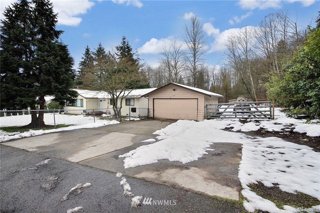 508 228th Street Southeast Bothell, WA 98021 - Photo 19 of 22 a view of a house with snow on the road