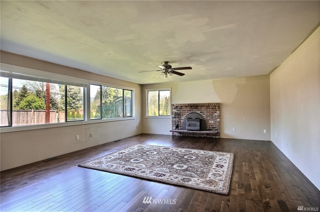 508 228th Street Southeast Bothell, WA 98021 - Photo 6 of 22 a living room with furniture and a fireplace