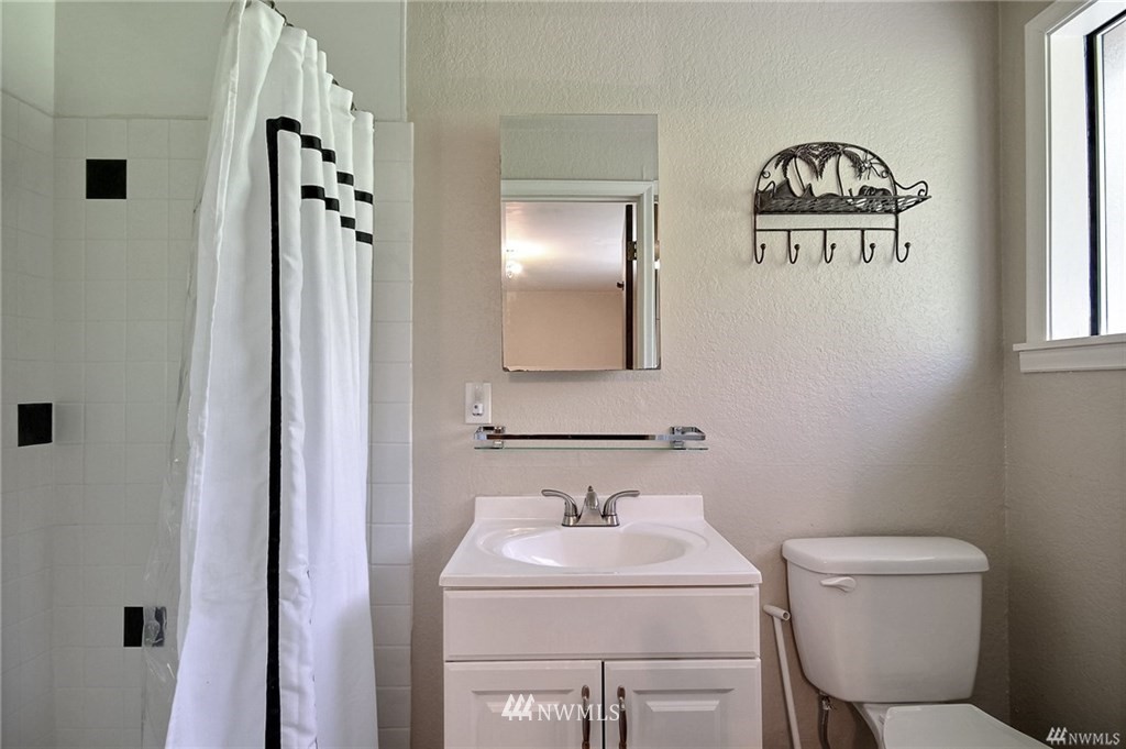 508 228th Street Southeast Bothell, WA 98021 - Photo 10 of 22 a bathroom with a sink and a mirror
