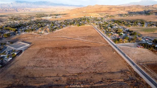 an aerial view of residential houses and a street