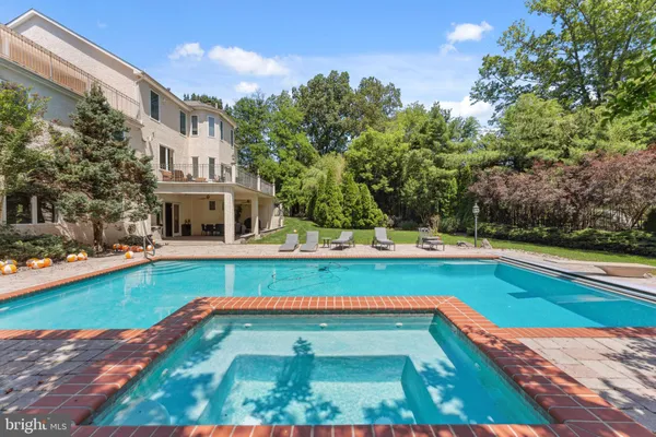 a view of swimming pool with chairs