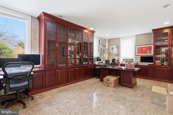 a view of a dining room with furniture a chandelier and wooden floor