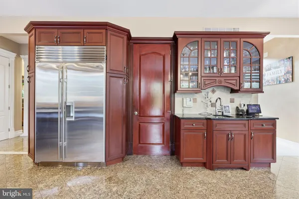 a bedroom with a bed tv and a window