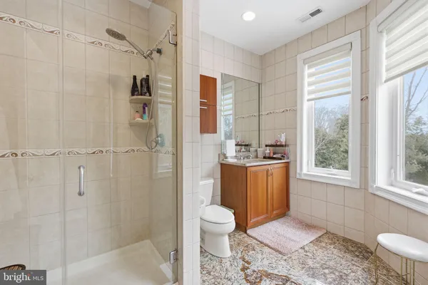 a view of staircase with railing and a rug
