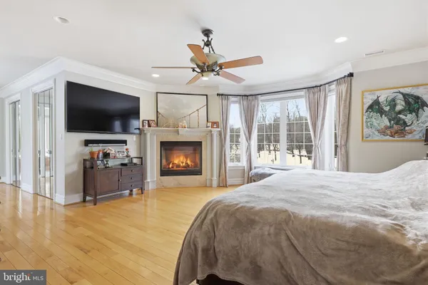 a kitchen with stainless steel appliances granite countertop a stove a sink dishwasher a refrigerator and cabinets with wooden floor