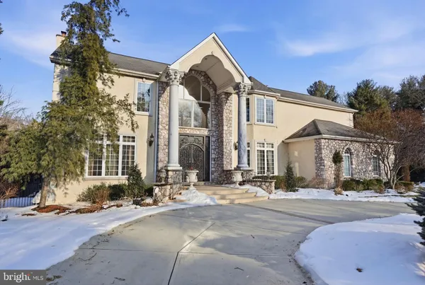 a front view of a house with outdoor seating
