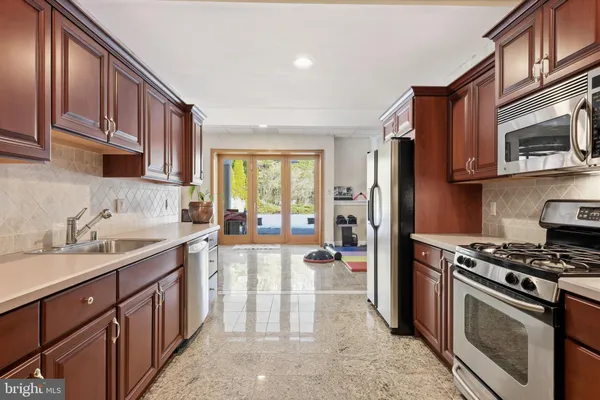 a bed room with a bed and a large window
