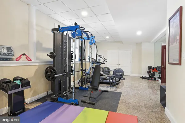 a living room with patio furniture and a floor to ceiling window