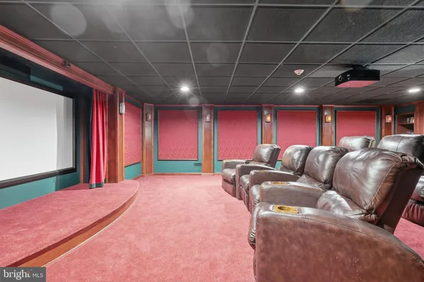 an aerial view of a house with swimming pool and garden space