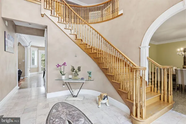 a view of an entryway with wooden floor and door
