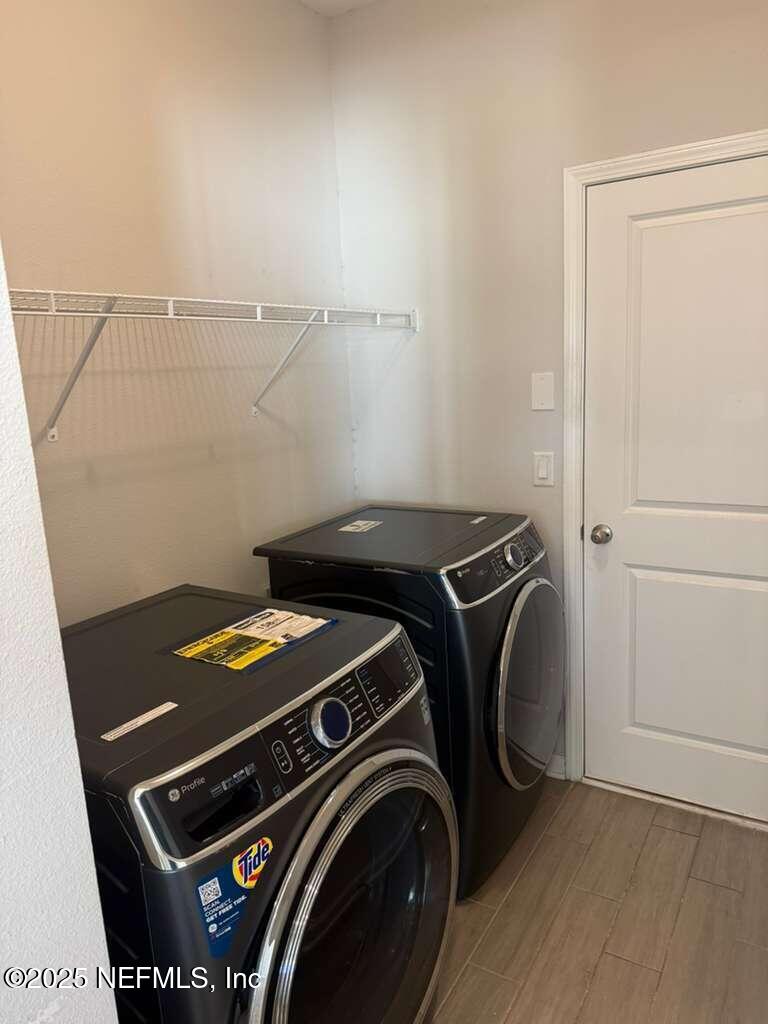 101 Ness Circle St. Augustine, FL 32095 - Photo 17 of 18 a utility room with dryer and washer