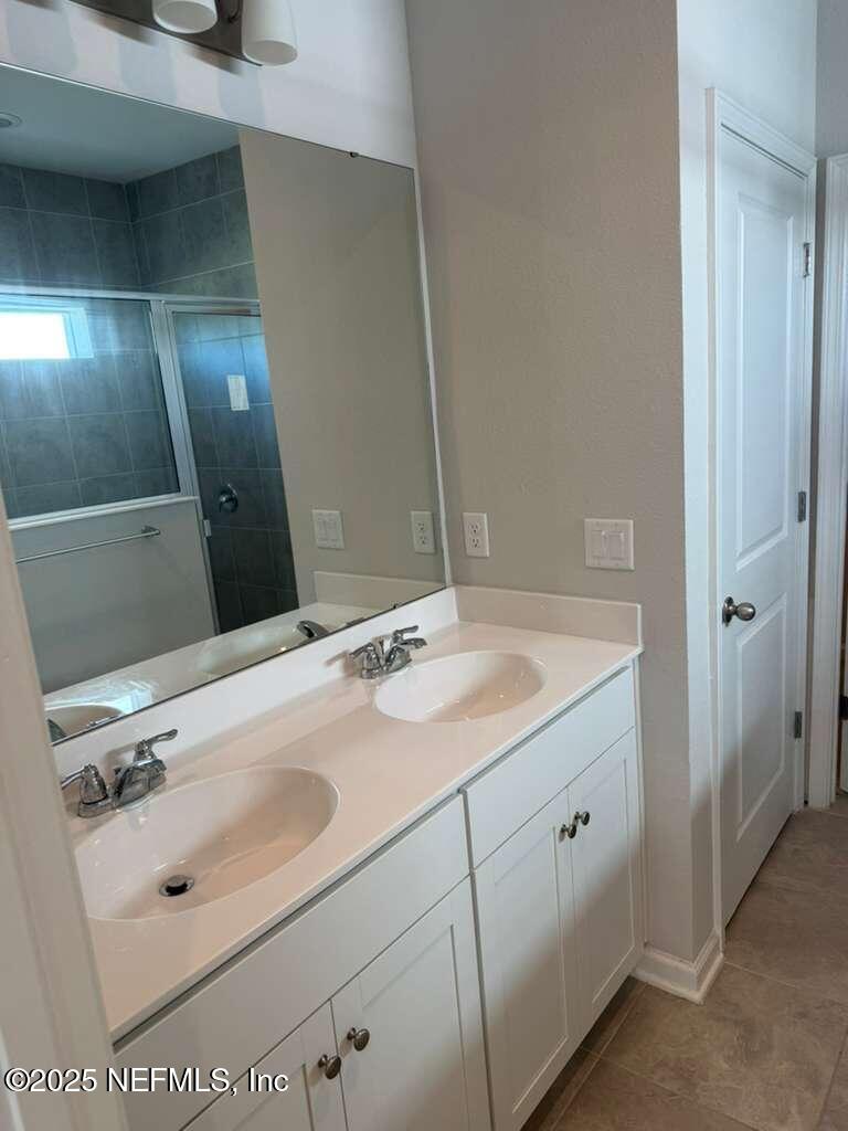 101 Ness Circle St. Augustine, FL 32095 - Photo 7 of 18 a bathroom with a sink and a mirror