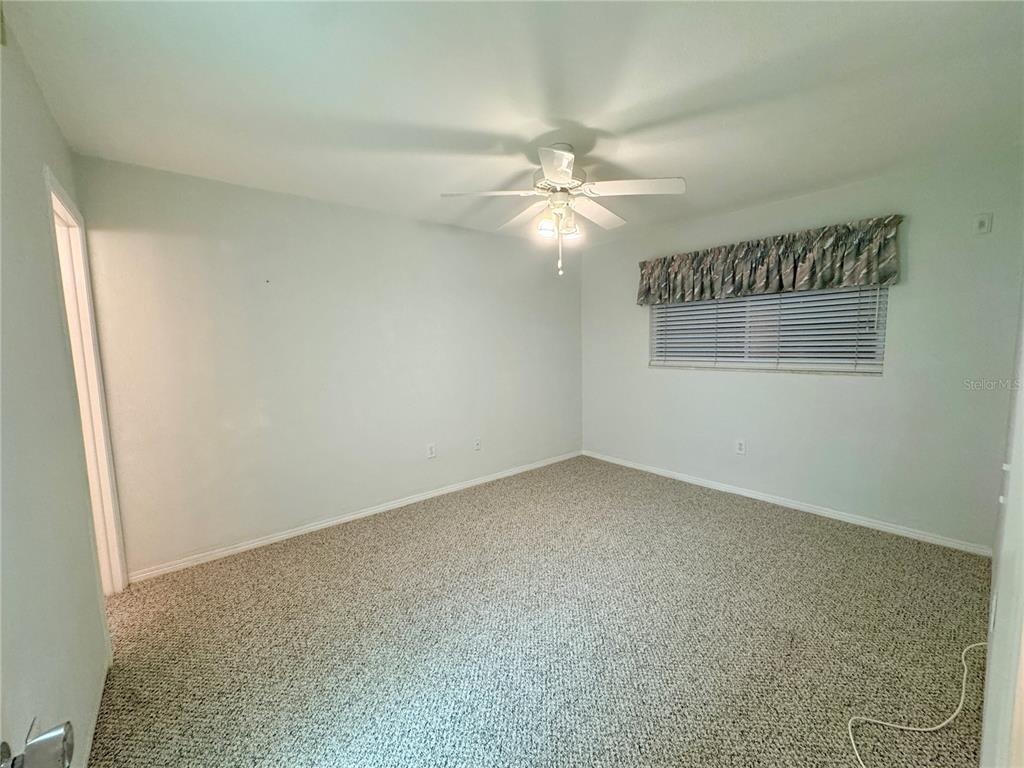 11201 80th Avenue, Unit 101 Seminole, FL 33772 - Photo 12 of 31 an empty room with a window