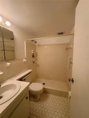 a view of storage and utility room with washer and dryer