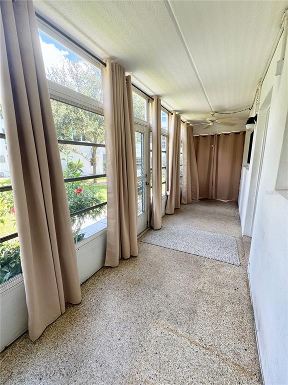 11201 80th Avenue, Unit 101 Seminole, FL 33772 - Photo 20 of 31 a view of livingroom with furniture and staircase