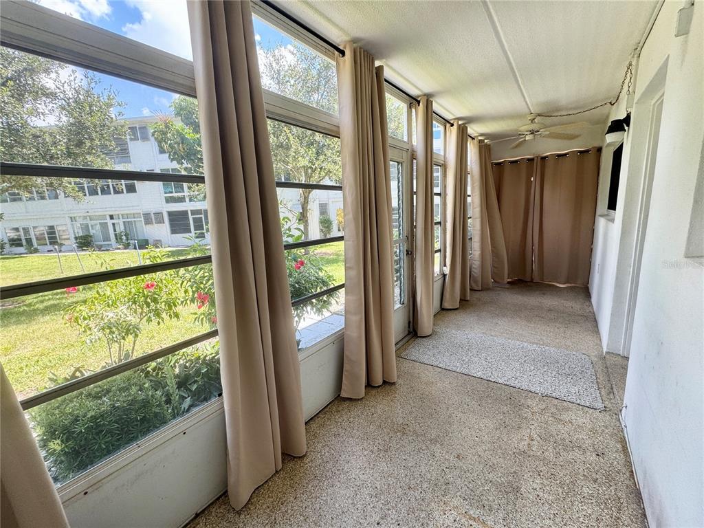 11201 80th Avenue, Unit 101 Seminole, FL 33772 - Photo 21 of 31 a view of hallway with furniture and a window