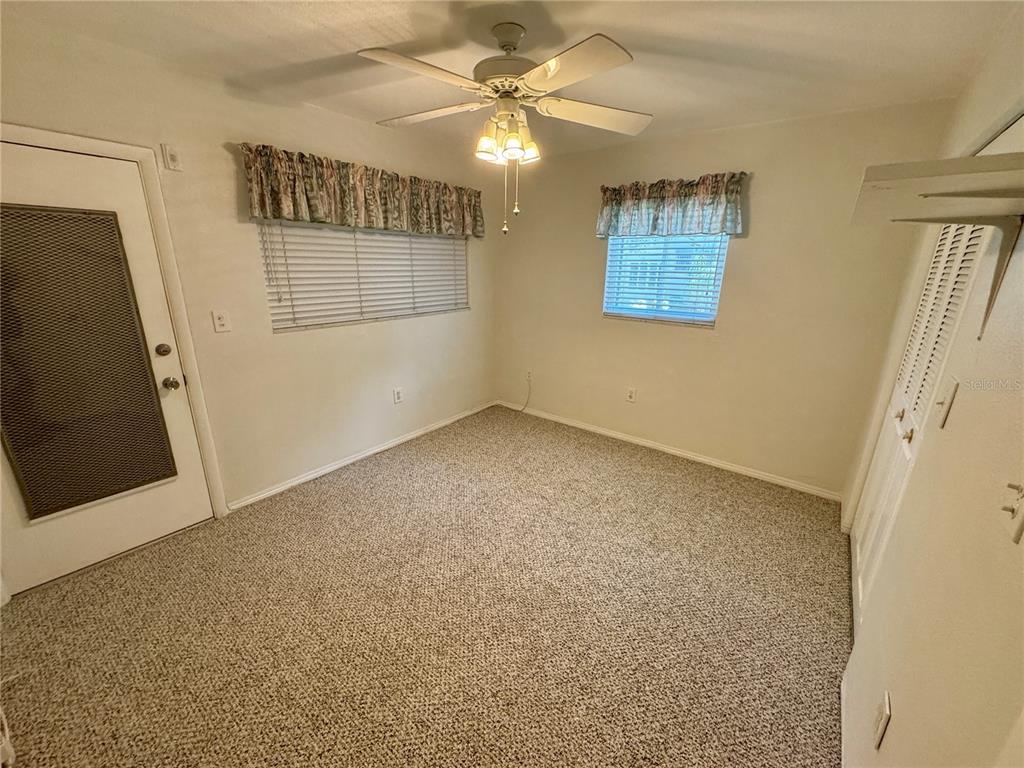 11201 80th Avenue, Unit 101 Seminole, FL 33772 - Photo 26 of 31 a view of an empty room with a window