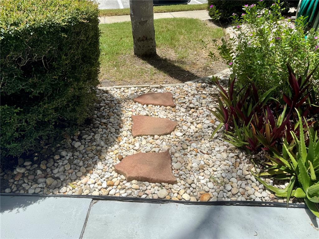 11201 80th Avenue, Unit 101 Seminole, FL 33772 - Photo 28 of 31 a view of a wooden floor with a tree