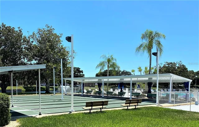 a view of yard with outdoor seating and barbeque oven