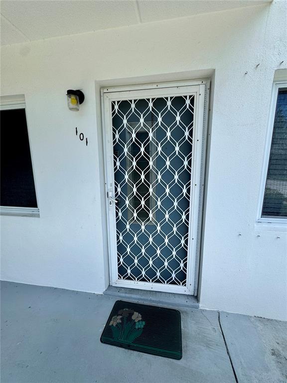 11201 80th Avenue, Unit 101 Seminole, FL 33772 - Photo 3 of 31 a view of wooden floor and cabinet in a room