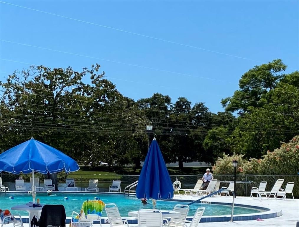 11201 80th Avenue, Unit 101 Seminole, FL 33772 - Photo 31 of 31 a view of yard with outdoor seating and barbeque oven