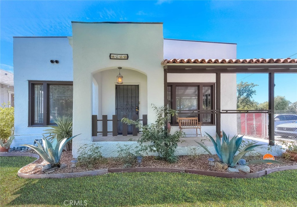 a front view of a house with garden