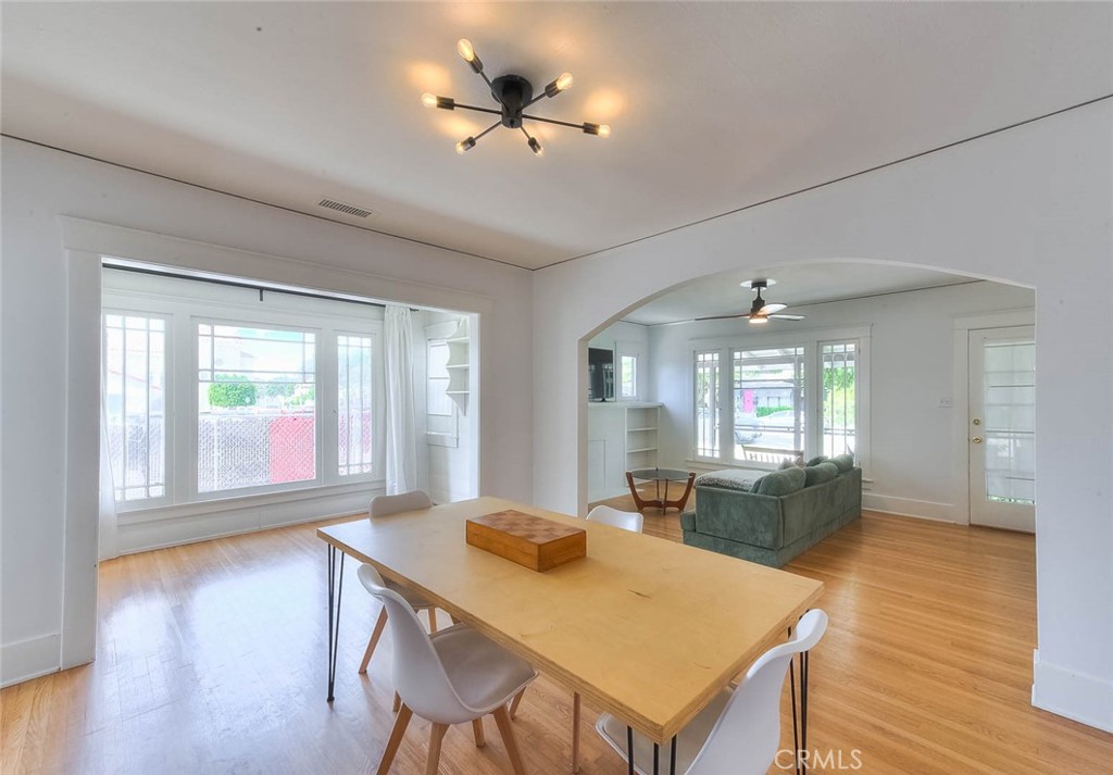 3222 Locust Street Riverside, CA 92501 - Photo 15 of 35 a view of a dining room with furniture window and wooden floor