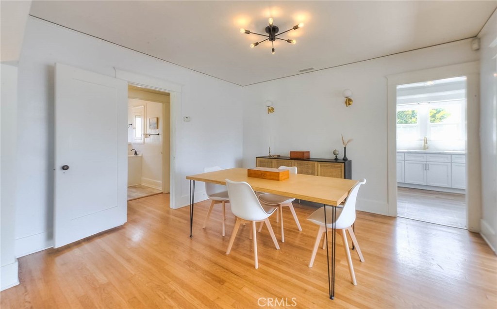 3222 Locust Street Riverside, CA 92501 - Photo 17 of 35 a view of a dining room with furniture and wooden floor