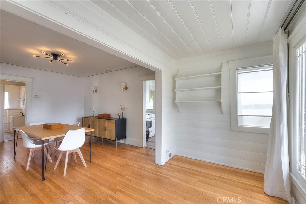 3222 Locust Street Riverside, CA 92501 - Photo 20 of 35 a view of a dining room with furniture and wooden floor