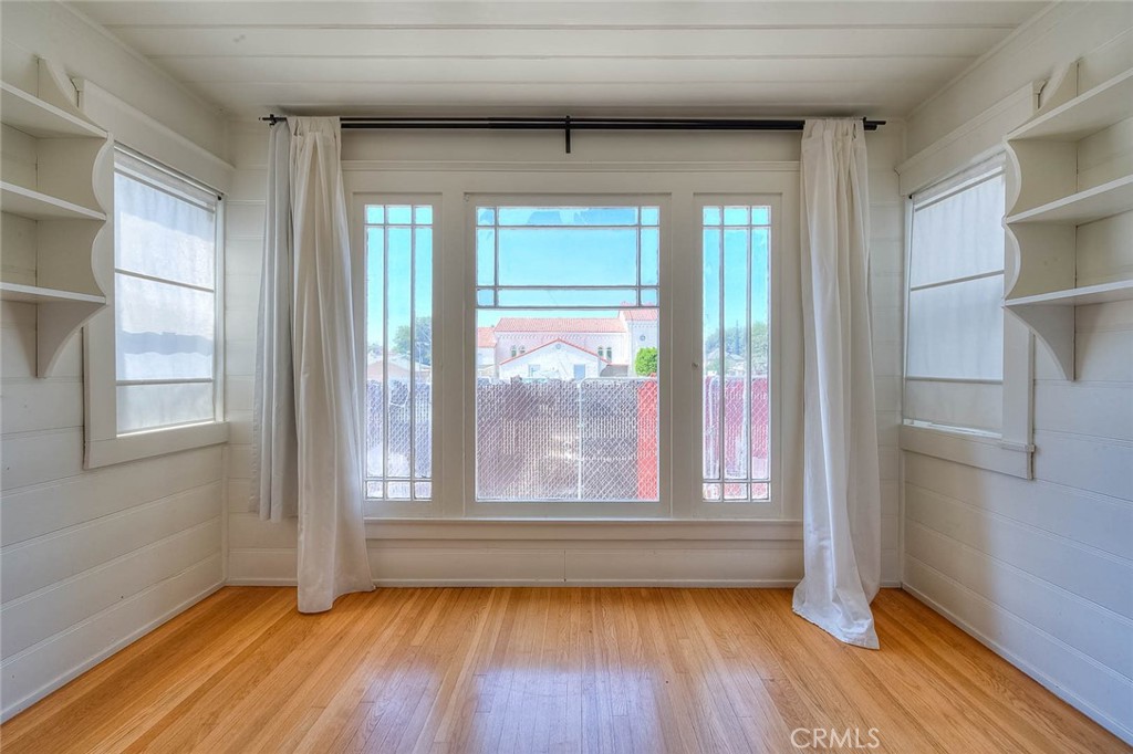 3222 Locust Street Riverside, CA 92501 - Photo 21 of 35 a view of empty room with wooden floor and fan