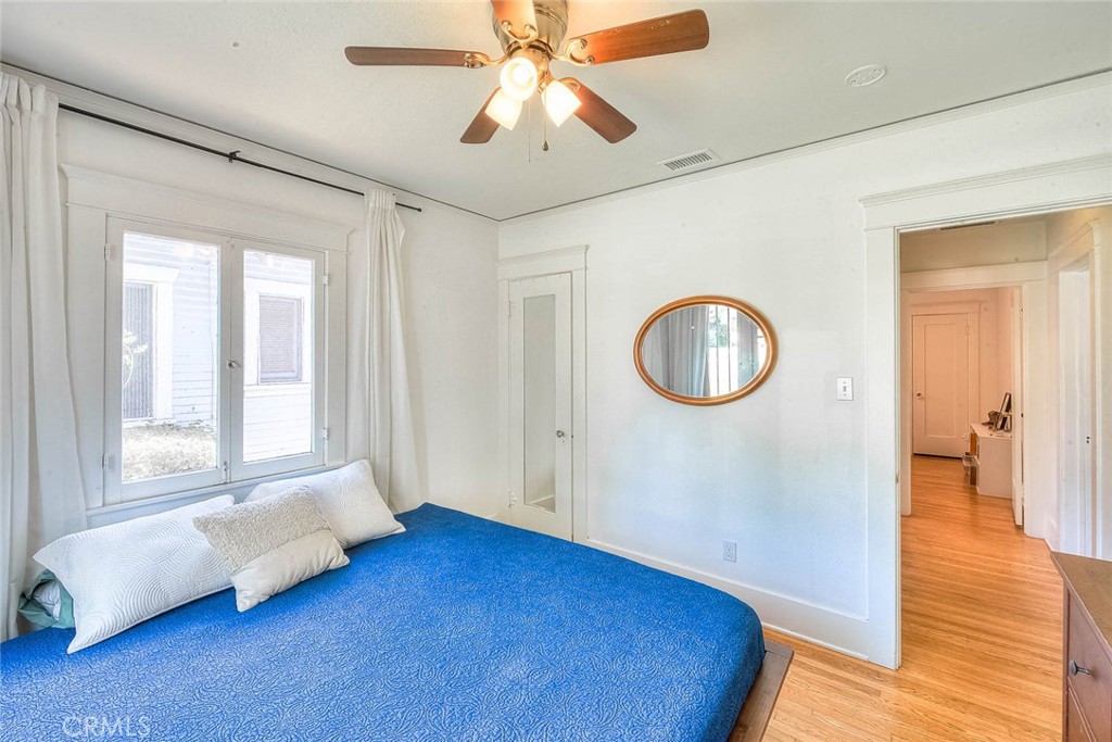 3222 Locust Street Riverside, CA 92501 - Photo 26 of 35 a spacious bedroom with a bed and a window