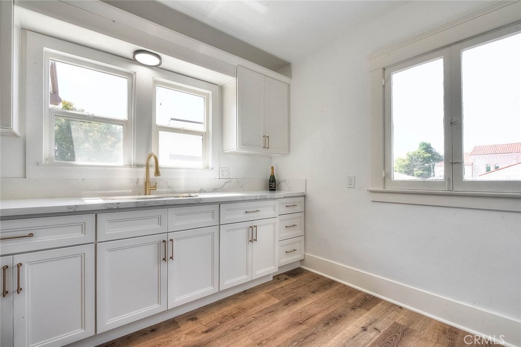 3222 Locust Street Riverside, CA 92501 - Photo 6 of 35 a bathroom with 2 sink and a window